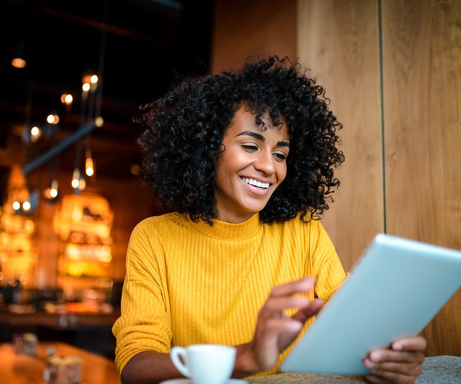 Remote worker browsing nearby work spots on a tablet